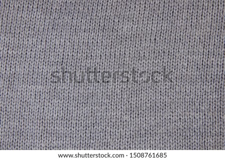 Knitwear fabric texture. Abstract knitting texture. Knitted Background. Sweater closeup.