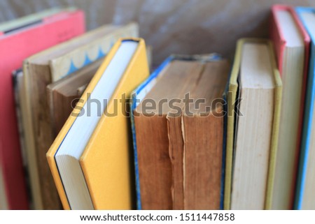 Close-up of many old books arranged in the library selective focus and shallow depth of field