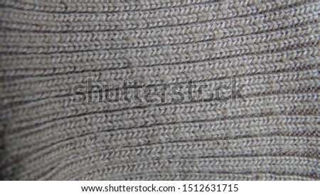 texture and background of large knitted brown fabric