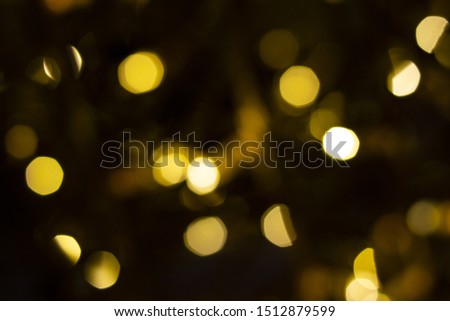 Golden garland out of focus. Festive background. Circles of light. Merry Christmas and Happy New Year. Copy space. Place for text and design