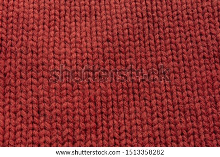 knitting with red woolen thread, background, texture