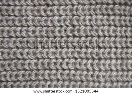 Simple pearl rib pattern textile wallpaper with empty space. Handmade knit warm cloth close up. Stitch knitted garment made of delicate wool yarn. Elegant textured material with woolly surface