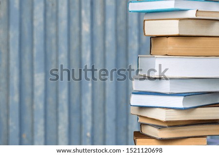 Books collection in pile on  background.