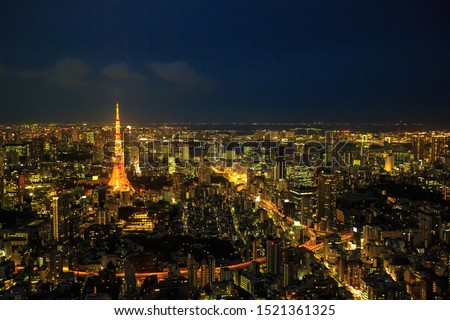 Aerial view of Tokyo Skyline at night with illuminated iconic Tokyo Tower in Minato District, Tokyo, Japan.