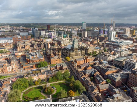 Aerial photo taken on the centre of Leeds in the UK, showing construction work being done on the Town Hall and the typical British town centre along with hotels, businesses and shopping centres,