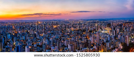 HDR (High Dynamic Range) and High Quality Panorama of a Scenic Colorful Landscape of Belo Horizonte City, Minas Gerais State, Brazil, During Dusk and with City Lights On from the Buildings