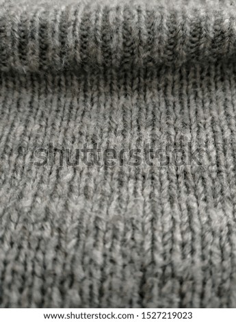 Closeup of wool knitted pattern for sweater clothes as texture background