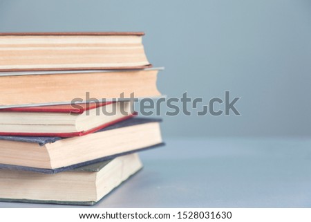 different books on the gray background