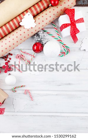 Christmas wrapping craft paper and decor on white wooden table.  Making xmas gifts  Top view, copy space. winter Holiday Concept. 