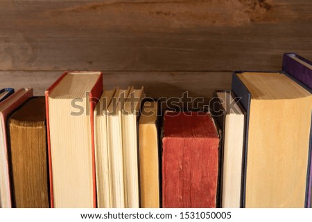 old books on the background of a wooden
