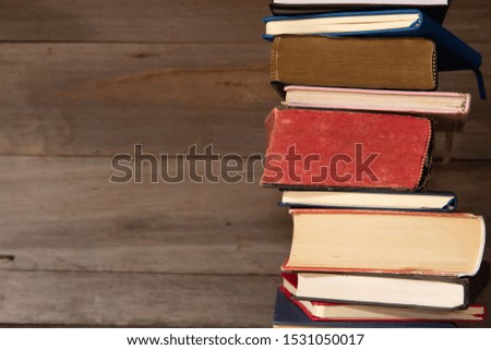 Many old books on wooden background.Knowledge is power.