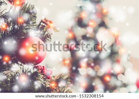 Christmas and new year holidays concept. Decorated christmas tree on blurred, sparkling and fairy background.