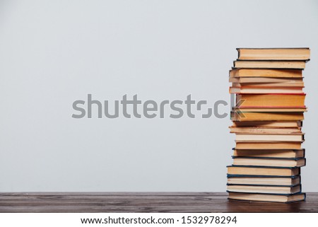 stacks of educational books university library background