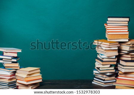 stacks of educational books university library background