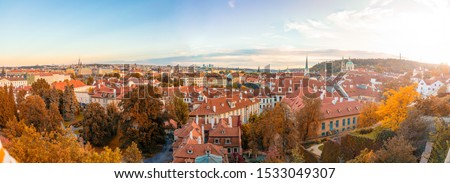 Panorama view of Prague city with red roofs and cathedral in sunset time, autumn time in Prague, Czech Republic