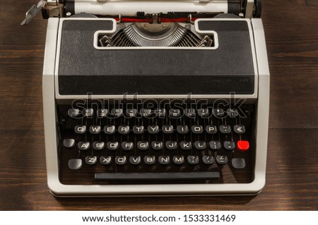 Old Typewriter on wooden desk