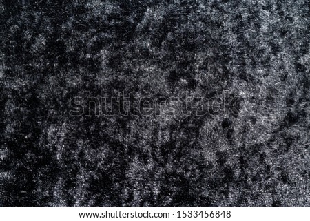 The shiny black velvet fabric reflects with beautiful light. Can be used as a Abstract, Background image.