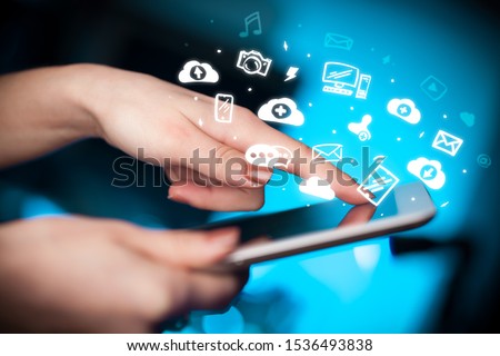 Hand holding tablet with social media concept