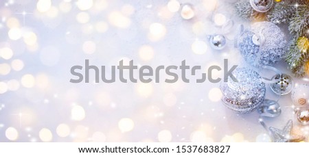 Merry Christmas and Happy New Year, Holidays greeting card with blurred bokeh background