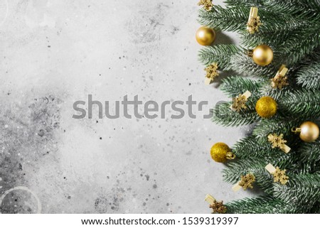 Christmas or New year holiday background with fir branches and snowflakes on clothespins. Top view with copy space