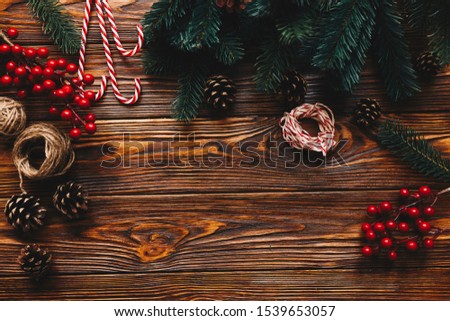 Top view of process preparation for christmas. Wooden table with hanmade Christmas tradition decor