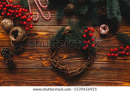 Work space. Top view of process preparation for christmas. Wooden table with hanmade Christmas tradition decor