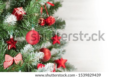 Christmas greeting card with decorated xmas fir tree and space for your greetings