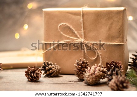 
DIY Christmas gift in craft packaging. Gift box and cones