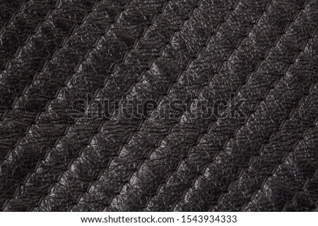Texture of black leather with stitching closeup. Background top view. Design Ideas