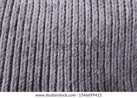 Texture of a gray scarf closeup.