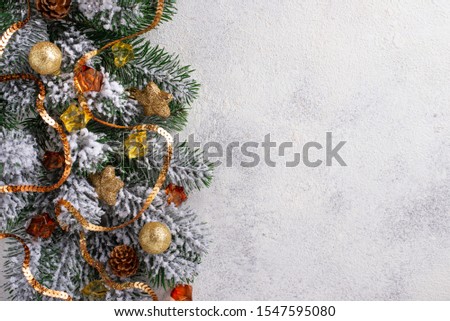 Christmas background with fir tree and golden decor. Top view