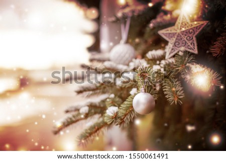 christmas tree branches with snow bokeh lights  and christmas decorations