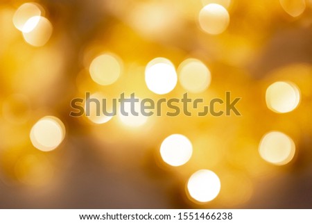 Christmas gold background. Golden holiday glowing abstract glitter defocused background