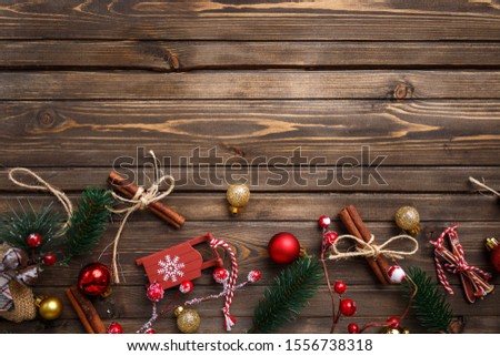 Christmas background with decorations on wooden board. Copy space