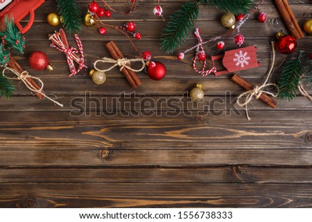 Brown wooden background with festive Christmas decoration, copy space