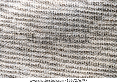beautiful original background from rough natural beige canvas