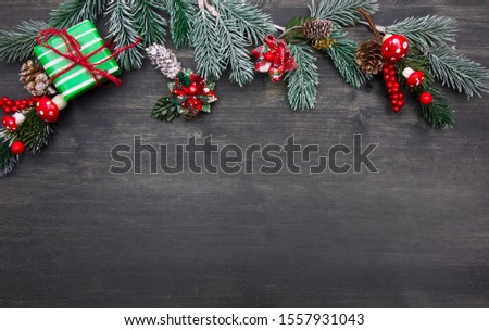 Christmas wooden background with Christmas tree and red decorations. Christmas Wreath with Rustic Wood Background. 