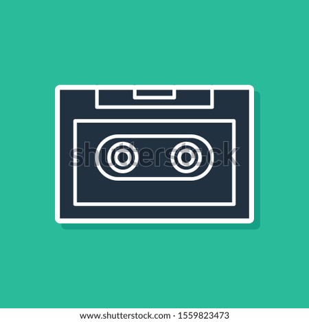 Blue Retro audio cassette tape icon isolated on green background.  Vector Illustration