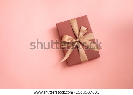 Pink gift boxes on pink background. Empty space for text. 