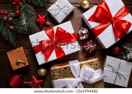 christmas presents and decorations on wooden table, flat lay.