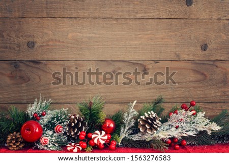 Christmas Vintage planked wood with christmas decoration, fir tree branches and free text space for greeting card and corporate design.