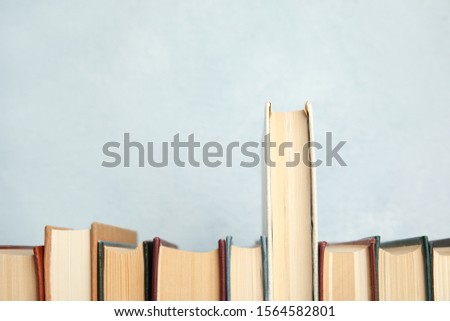 Collection of old books on light background