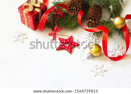 Christmas, new year concept background. Xmas composition. Branches of spruce, present and red decorations. Copy space.
