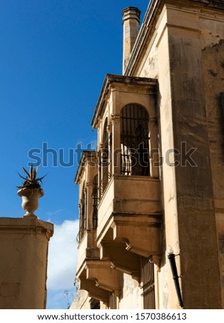 Balcony with metal railings in an old house in the city of Mdina, Malta