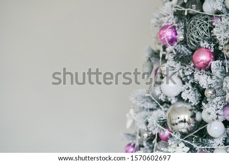 Christmas tree with New Year s balls and a garland. Copy text.