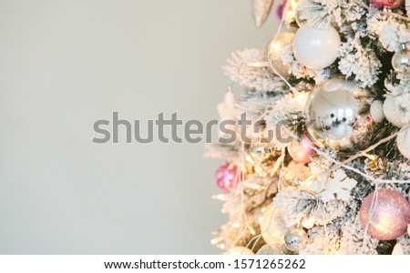 Christmas tree with New Year s balls and a garland. Copy text.
