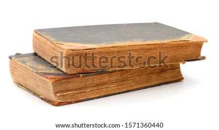 Two vintage books stacked together isolated over white background 