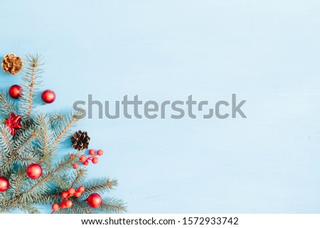Christmas decoration on a blue wooden background, flat lay. Space for text