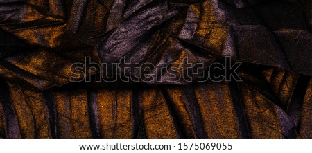texture. background. template. wallpaper. black silk fabric with yellow golden stripes, wrinkled fabric