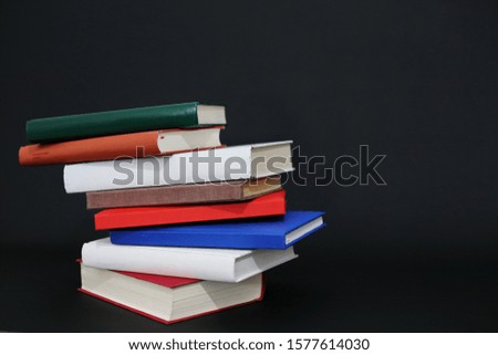 Stack of books on black background